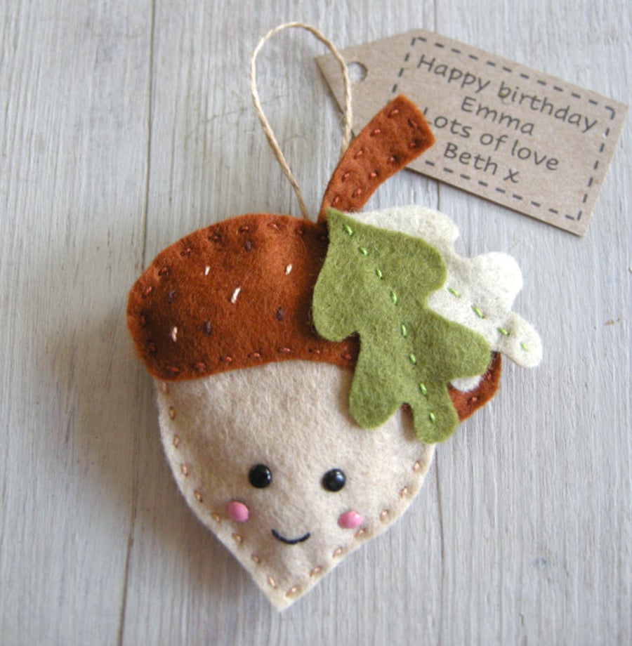 Handmade decoration which can be personalised. A felt acorn 