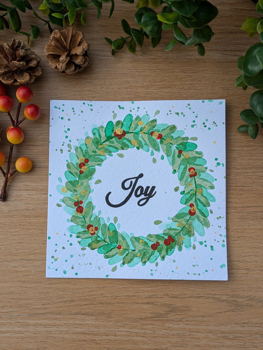 Hand painted and lettered watercolour Wreath Joy Christmas Card.