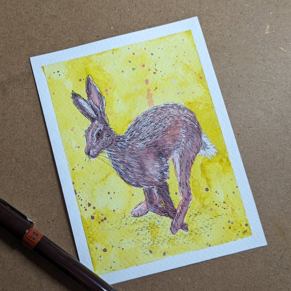 Gouache illustration of a running hare