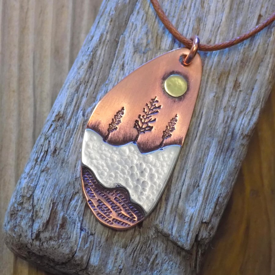 Copper and silver 'winter sun' mixed metals pendant 