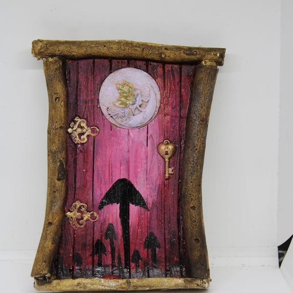 Traditional fairy door with ladybird on the step