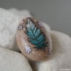 little blue feather - painted pebble
