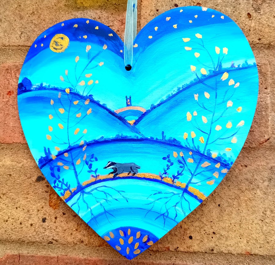Badger by moonlight  on a heart shape 18 x 18 cm   with  golden leaves 