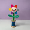 Embroidered Happy Flower in Wooden Bobbin- Pale Pink Face and Purple Bobbin