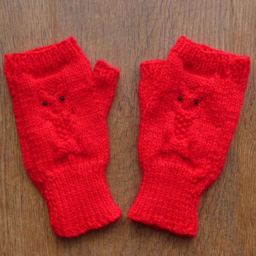 Knitted handmade red fingerless mittens with owl pattern