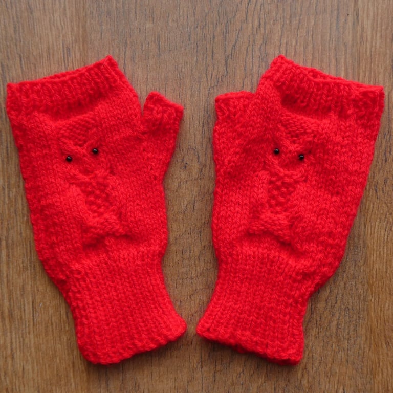 Knitted handmade red fingerless mittens with owl pattern