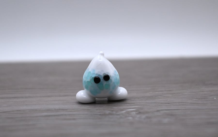 small glass wisp figure