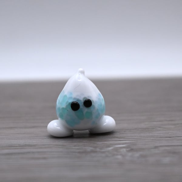 small glass wisp figure