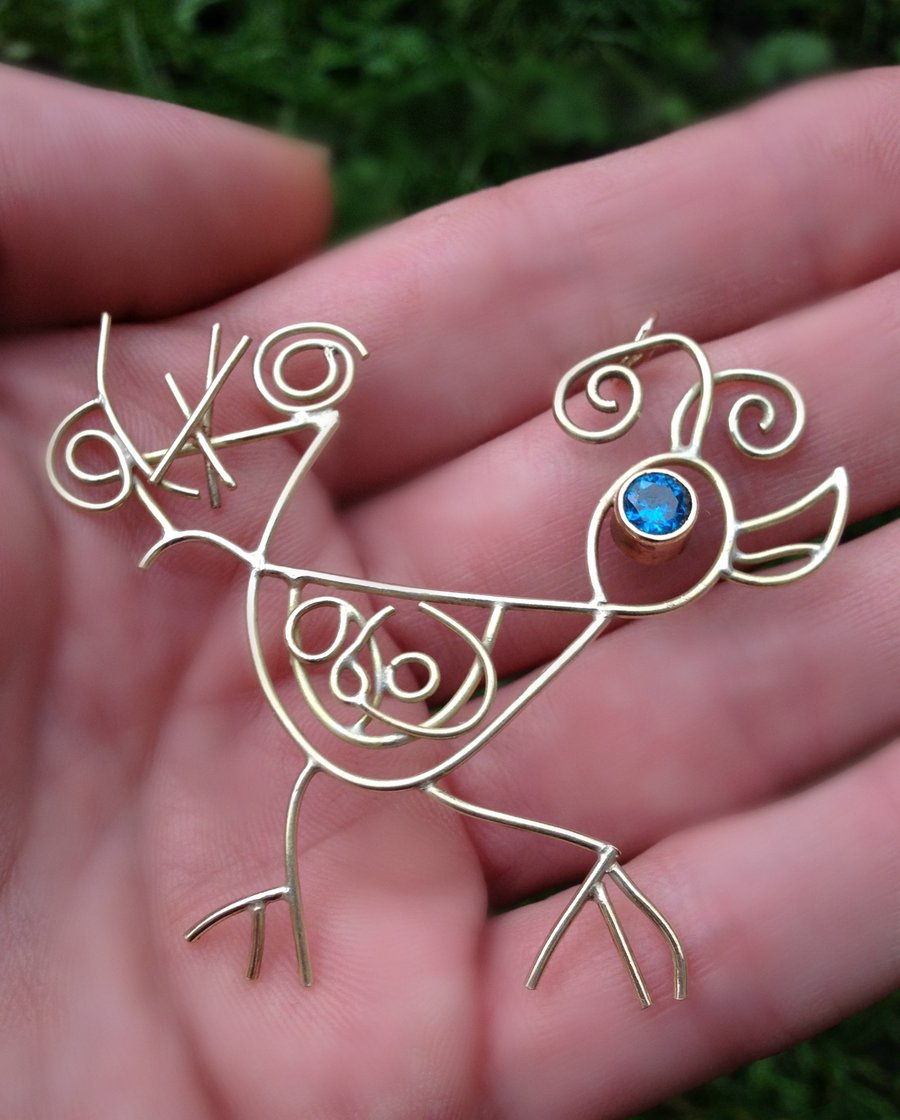 Solid 9ct gold pendant with blue gemstone eye, handmade from a childs drawing