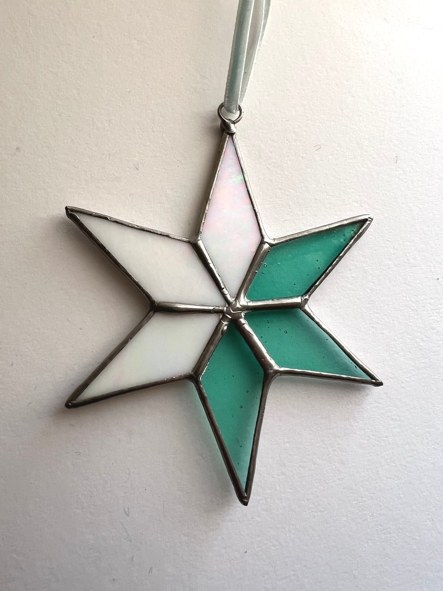 Pastel hued white and pale blue green stained glass Christmas star decoration