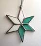 Pastel hued white and pale blue green stained glass Christmas star decoration