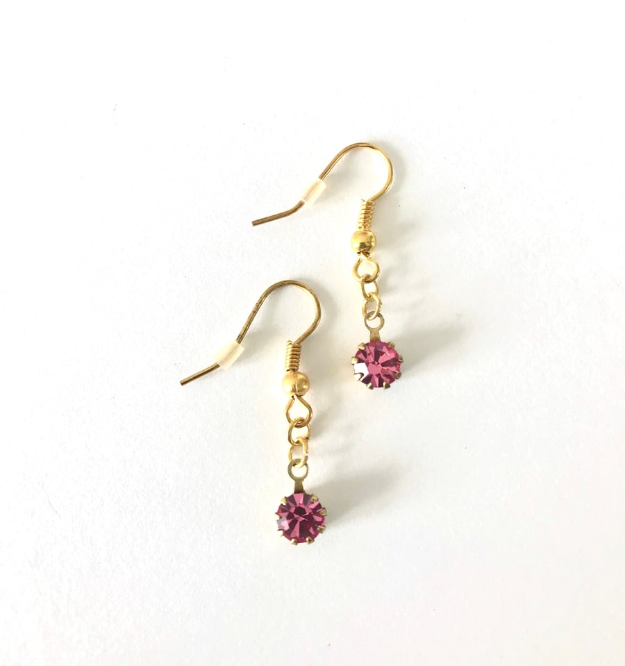 Round swarovski  pink stone earrings. 