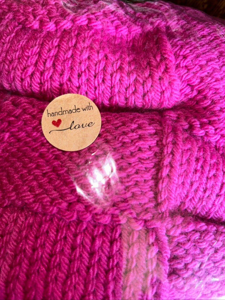 Handknitted baby blanket cerise pink