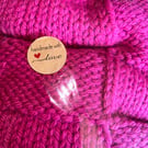 Handknitted baby blanket cerise pink