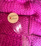 Handknitted baby blanket cerise pink