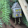 Baba Yaga's Chicken Leg Hut hand carved and painted decoration with dangly legs