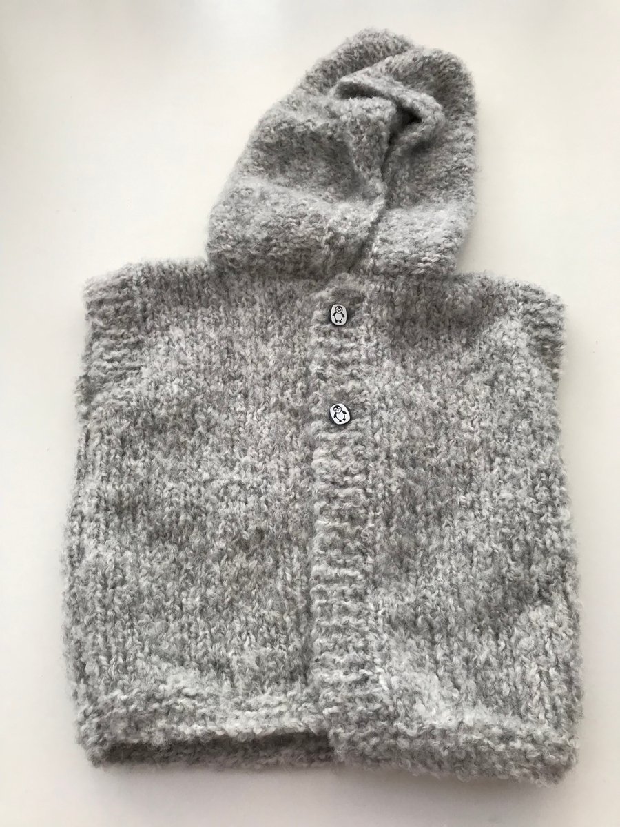 Hand knitted baby hooded gilet 