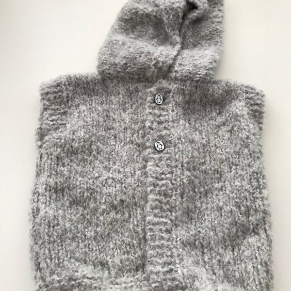 Hand knitted baby hooded gilet 