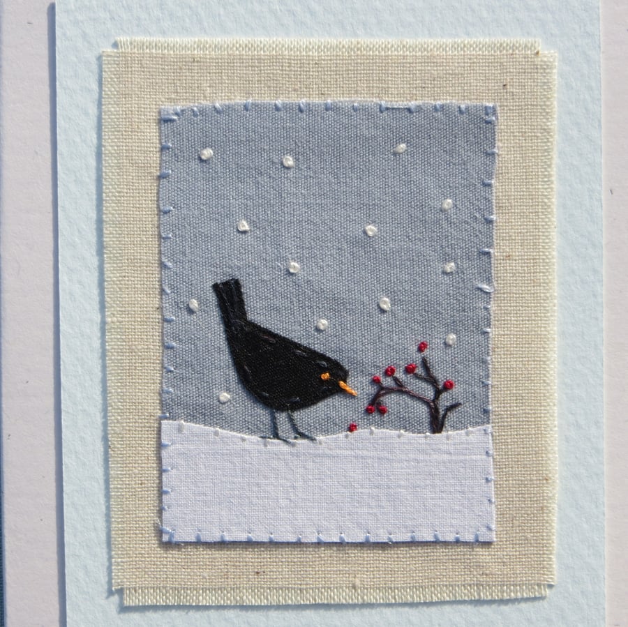 Hand-stitched card for Christmas with blackbird and berries