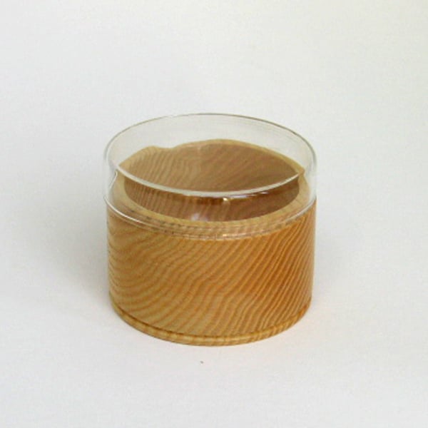 A trinket pot in glass and wood