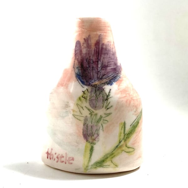 Flat backed stem vase with thistle and clover