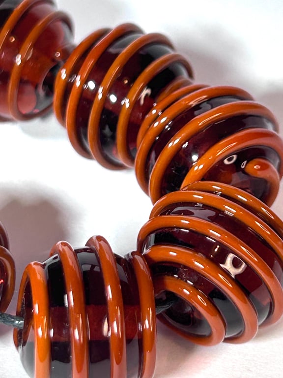 Handmade orange and brown patterned lamp work glass beads