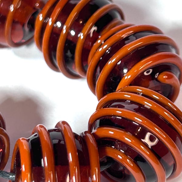 Handmade orange and brown patterned lamp work glass beads