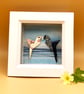 Hand folded Origami Parrots on a print background, original picture in box frame