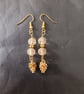 Gold pine cone charm dangle earrings with star detail beads