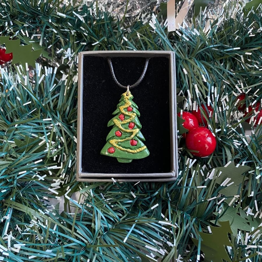Christmas tree hand painted polymer clay pendant on a black cord chain.