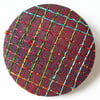 One inch badge