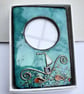 SMALL ENAMELLED PHOTO FRAME DEPICTING THE SEA - SEA GREEN - Image 1