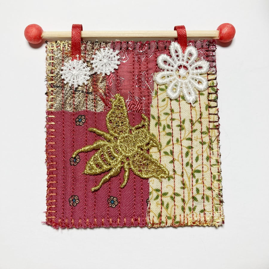 Bee on red background, miniature quilted patchwork wallhanging