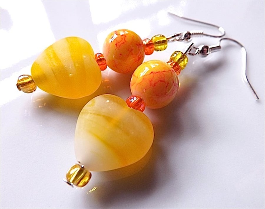 Rainbow dangles earrings for pierced ears, yellow lampwork heart.