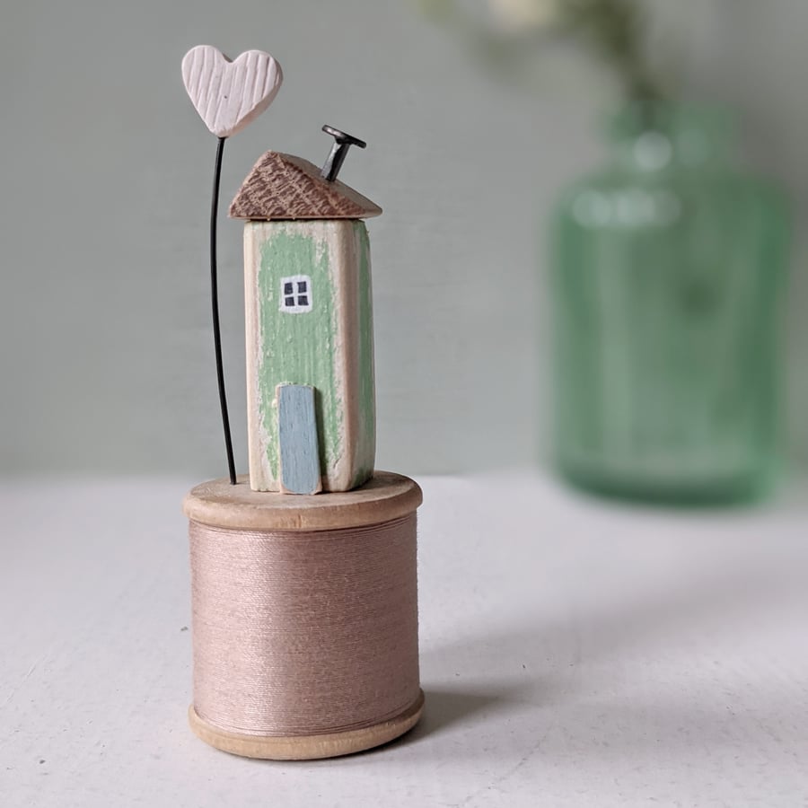 Wooden House on a Vintage Bobbin with a Clay Love Heart 