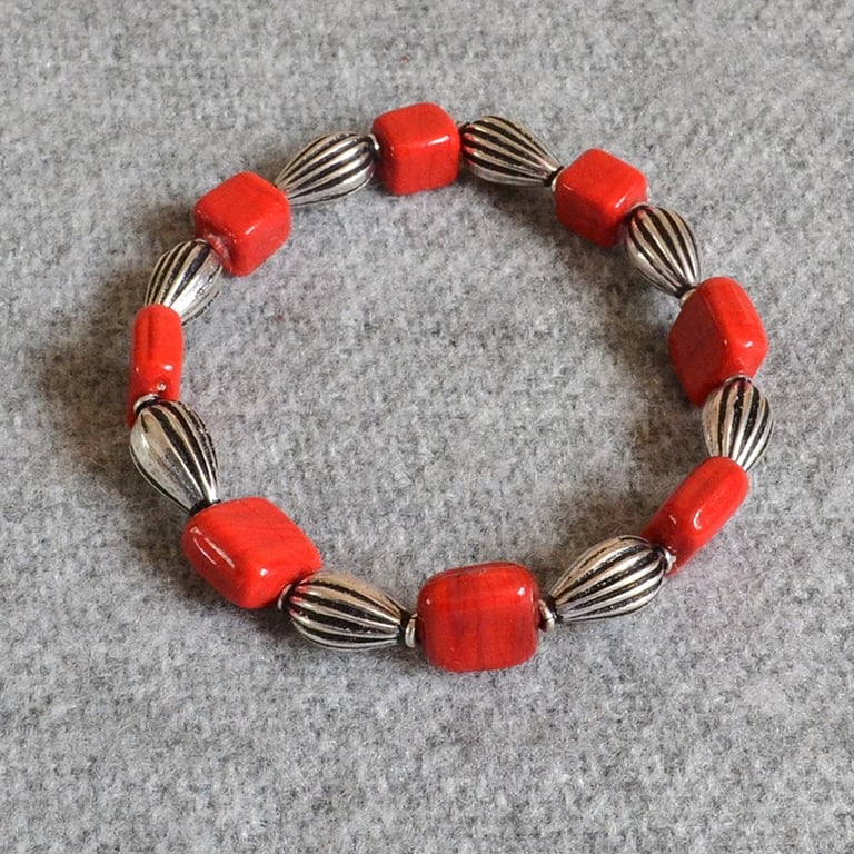 Opaque Red Glass and Metal Tube Bead Elastic Bracelet