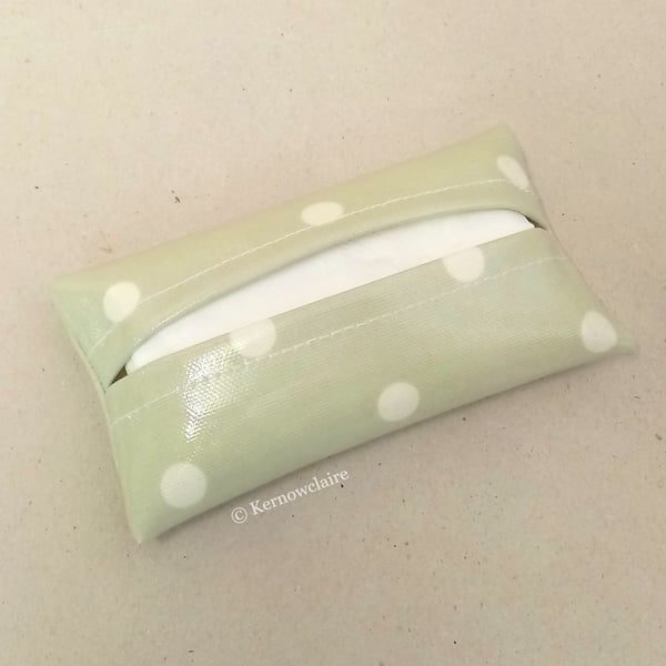 Tissue holder in pale green with white spots, tissues included.