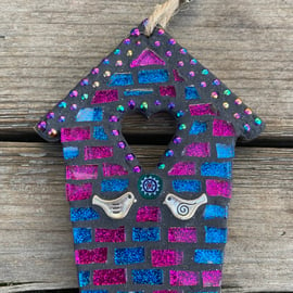 Mosaic birdhouse decoration with love birds