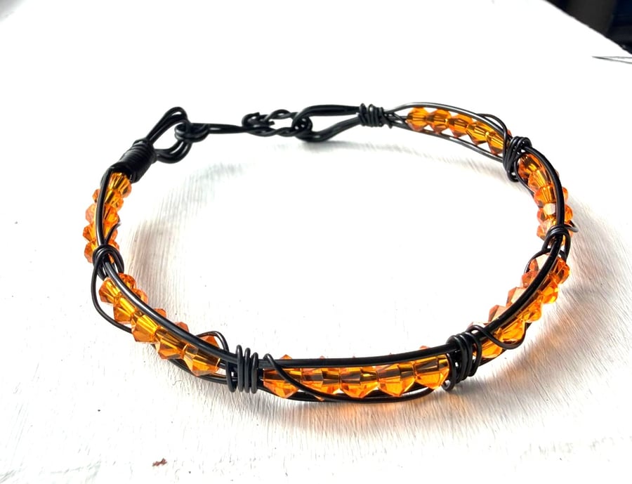 Caged Amber - black and orange bracelet