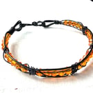 Caged Amber - black and orange bracelet