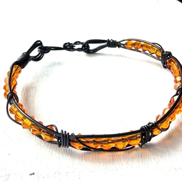 Caged Amber - black and orange bracelet