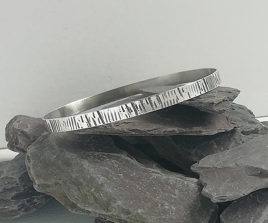 Silver Bangle with a Bark Texture