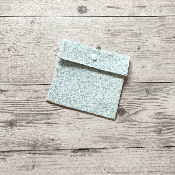 Discreet sanitary pouch. Feminine products holder. Ditsy floral Ivory.