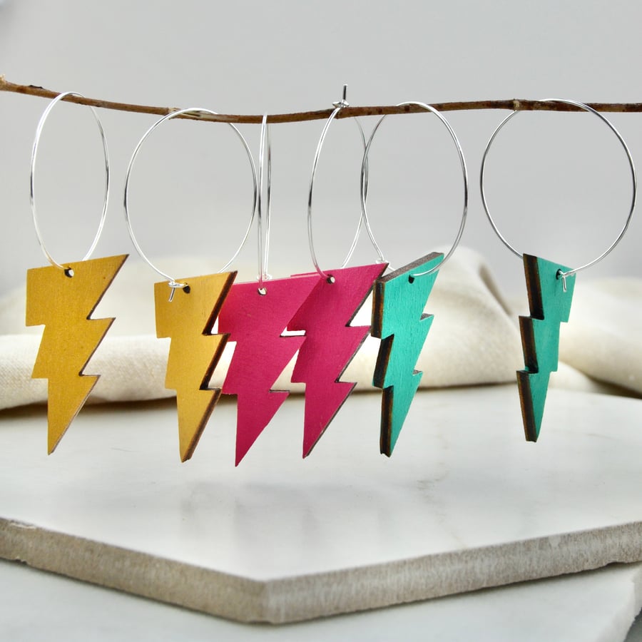 Silver hoop earrings with handpainted lightning bolt shapes