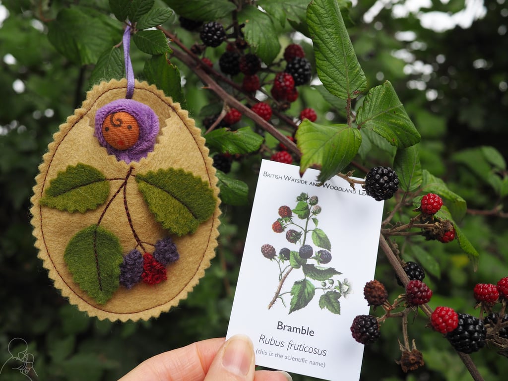 Bramble baby doll - nestled in a wool felt pod with blackberries