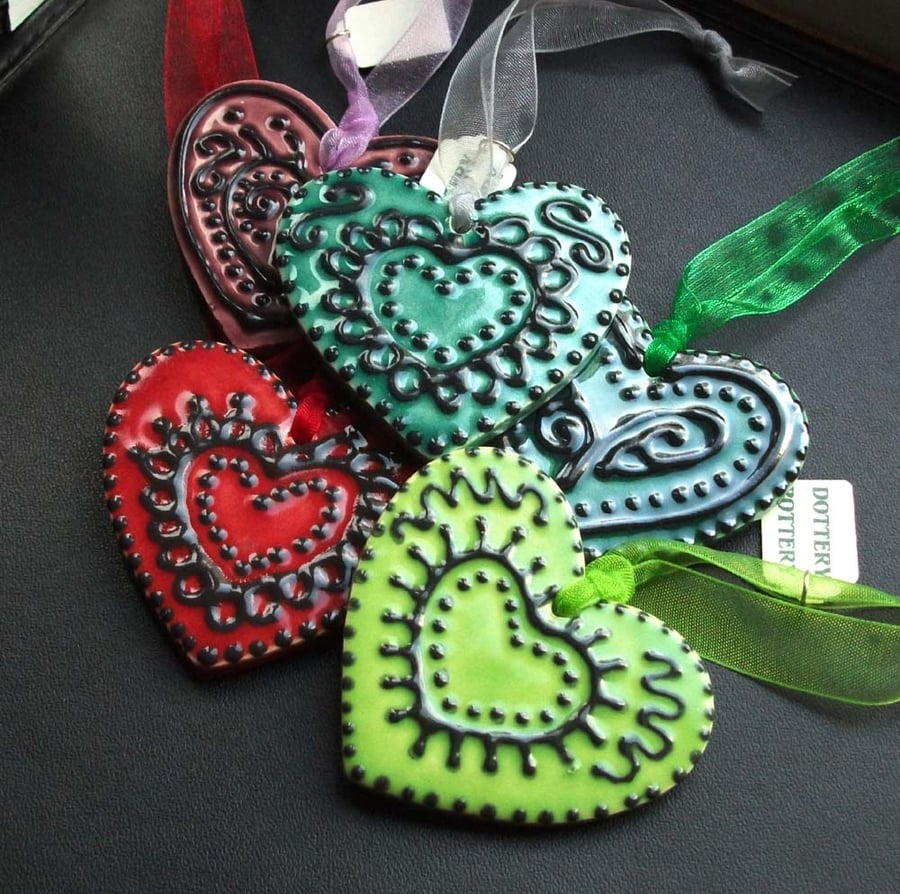 Set of five small folk art Christmas hearts