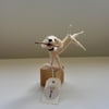 Needle felt whimsical dog fetching a stick. 10cm tall 