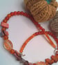 Silver Skull Pendant on an Orange Red Purple & Pink Shell Beaded Necklace - Image 8