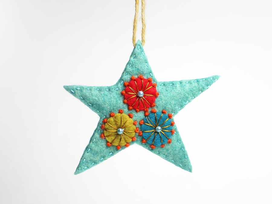 Blue star hanging ornament with folk embroidery