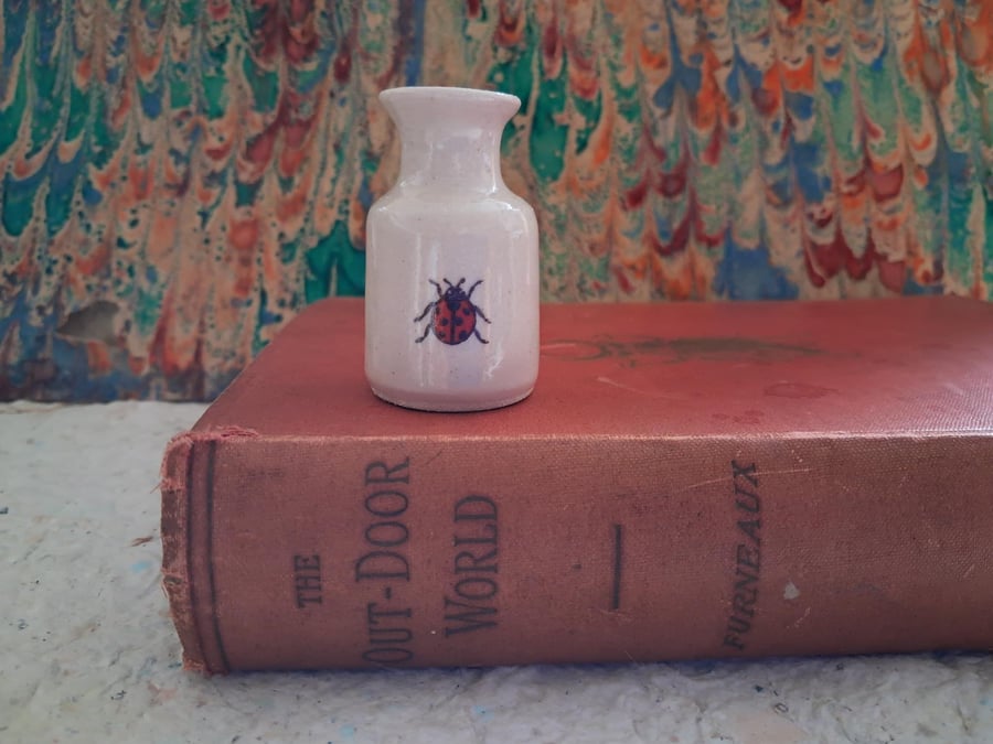 Miniature stoneware bud vase with ladybird decoration